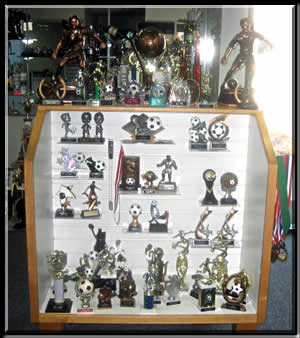 Soccer trophies and awards display at Dyekman Trophies, Inc., in Fort Collins, Colorado.
